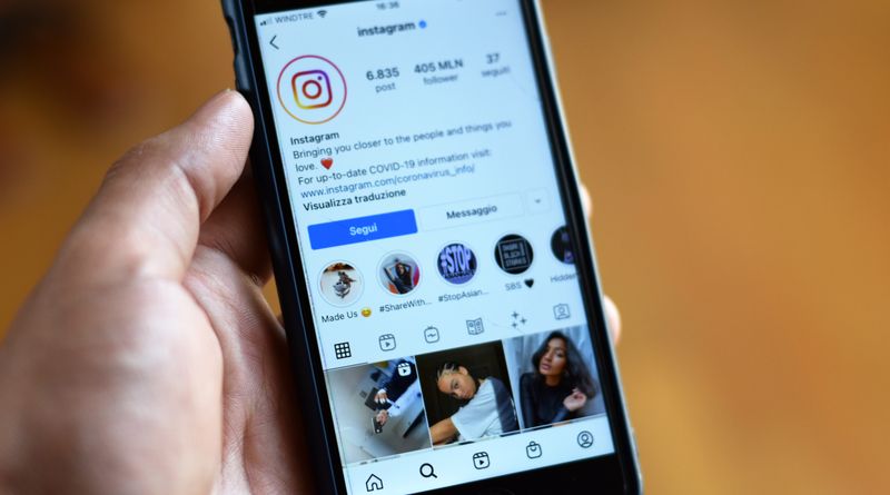 Close-up of a smartphone displaying an Instagram profile screen.